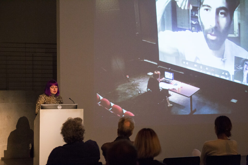 Angela Washko showing documentation of a webcam based performance.