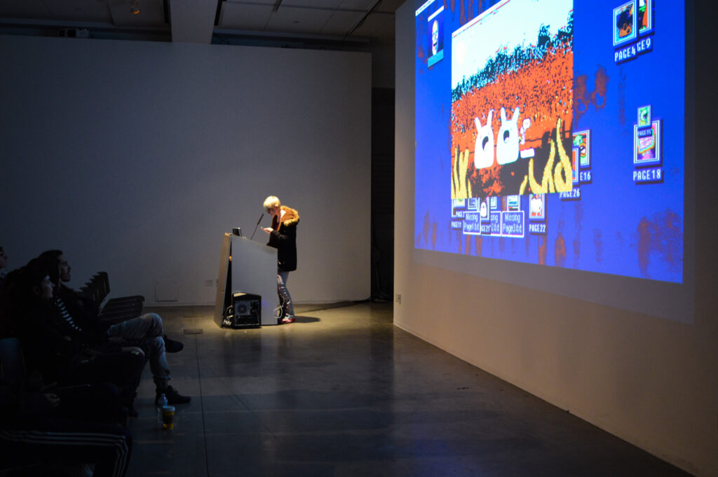 NATHALIE LAWHEAD talks at a pedestal.