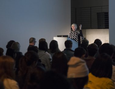 Helen Molesworth presenting from the podium.