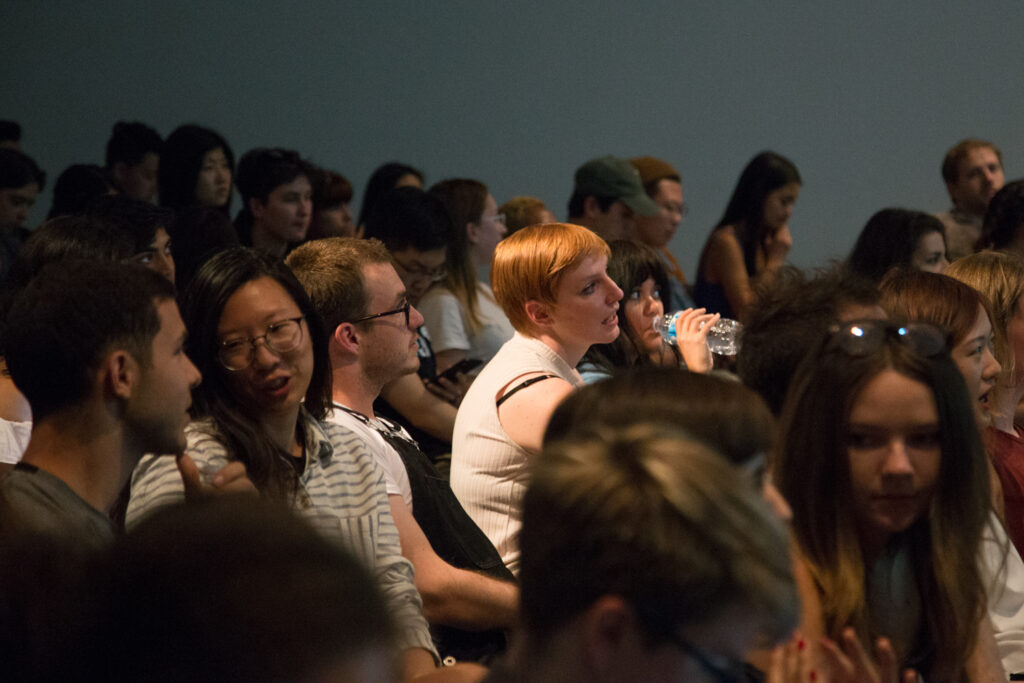 Picture of the audience sitting.