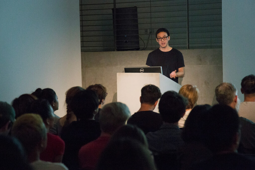 Ian Cheng addressing the audience members.