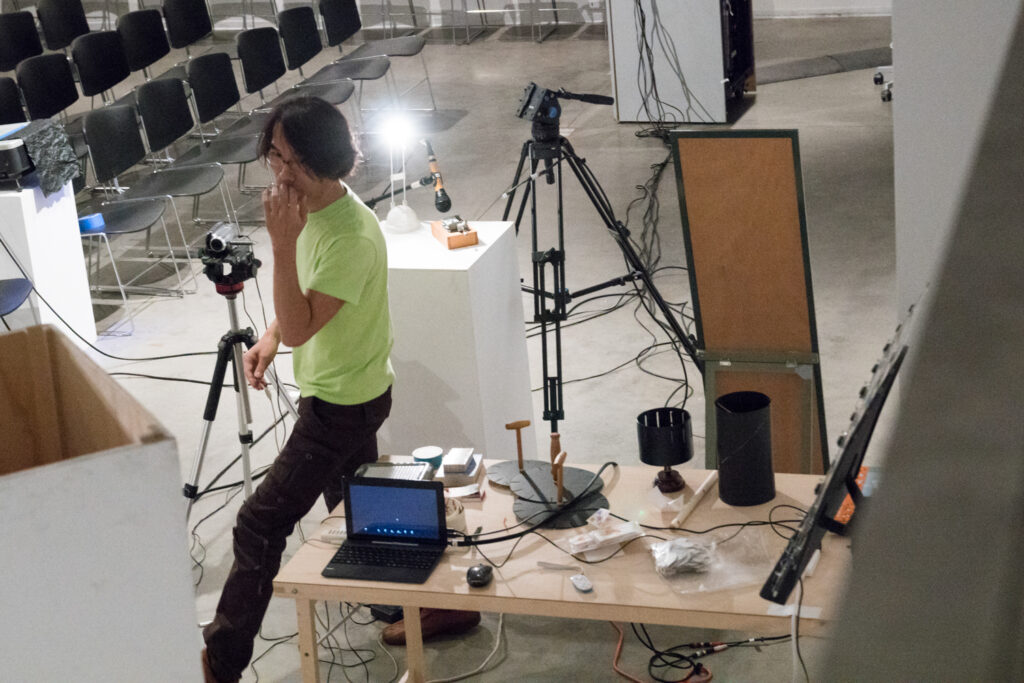 Toshio Iwai preparing for his lecture.