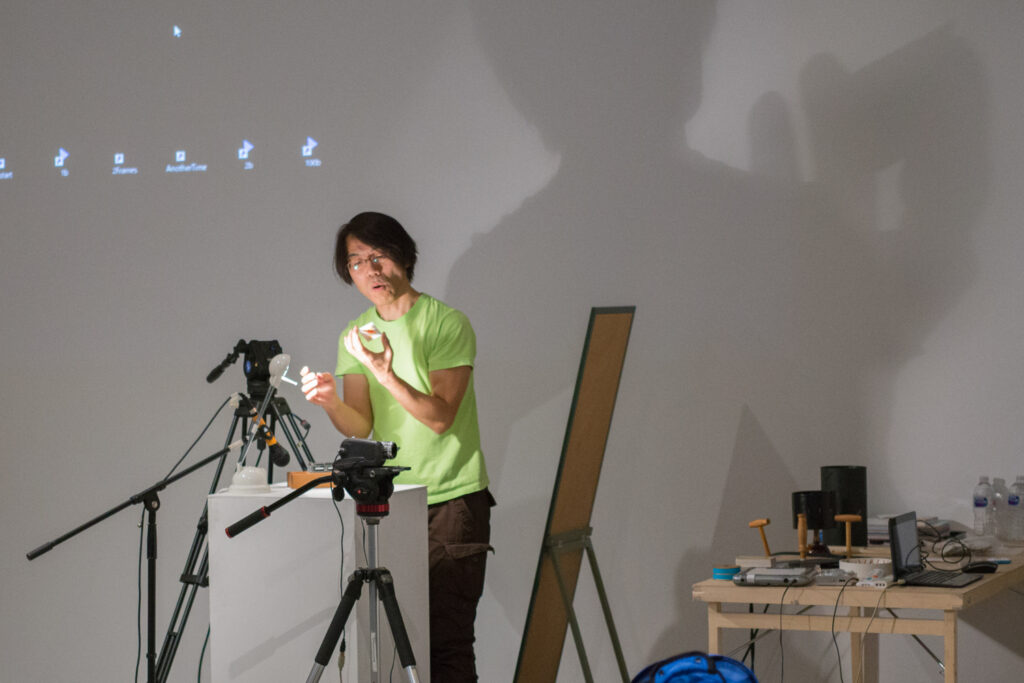 Toshio Iwai preparing for his lecture.