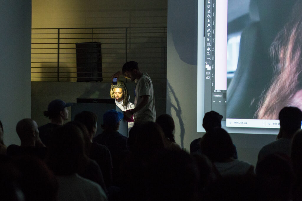 Yung Jake showing his photoshop workflow in front of the audience in the EDA pit.