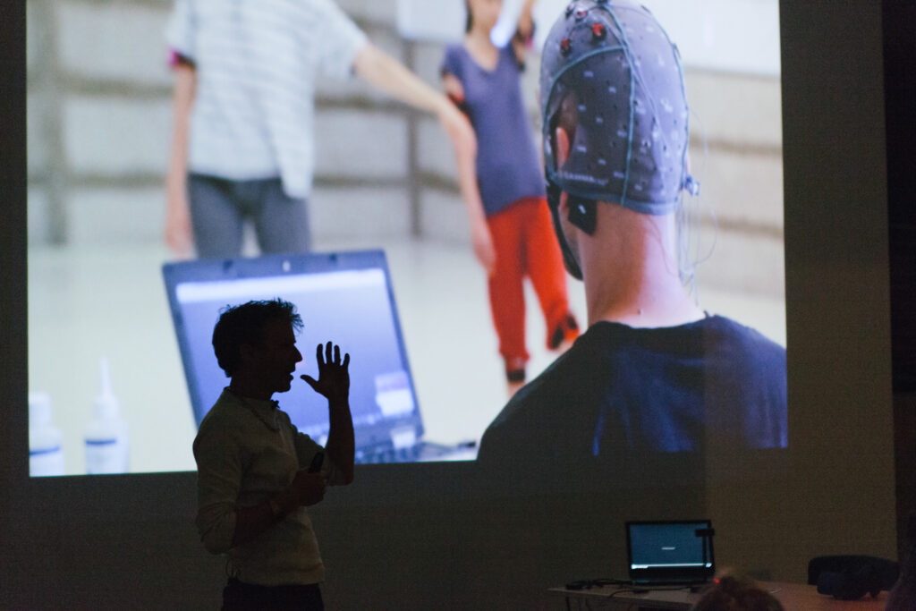 Picture of a person wearing a medical cap with sensors in the medical cap.