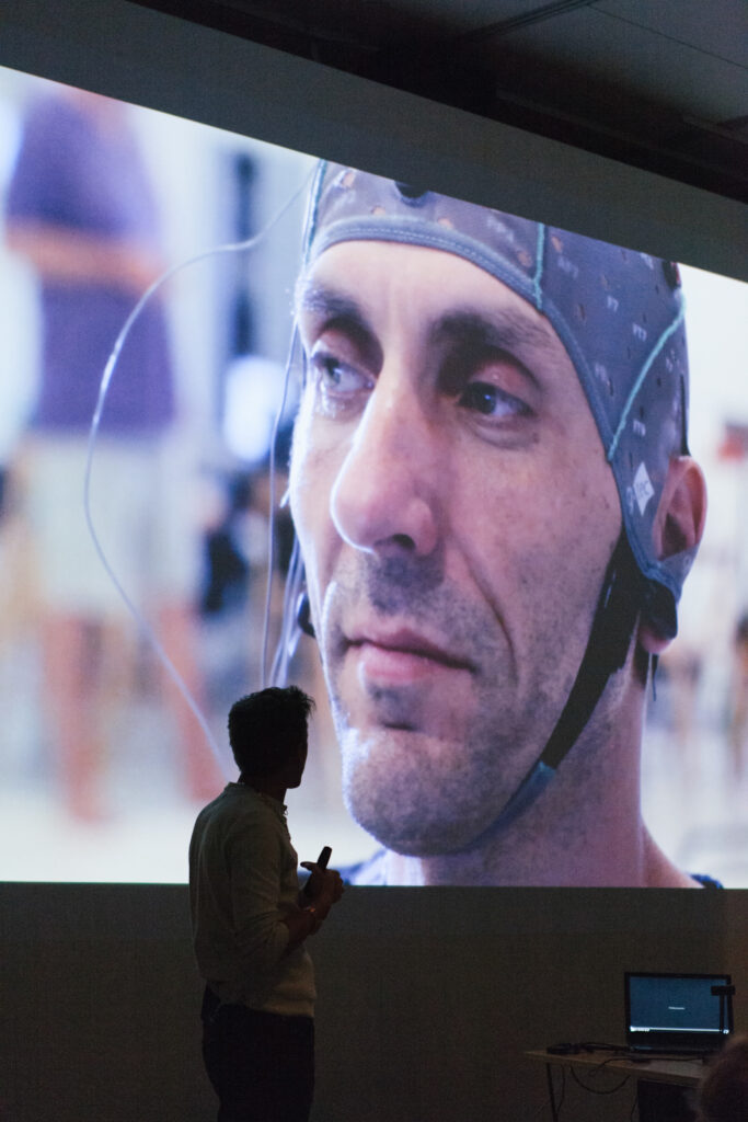 Picture of a person wearing a medical cap with sensors in the medical cap.