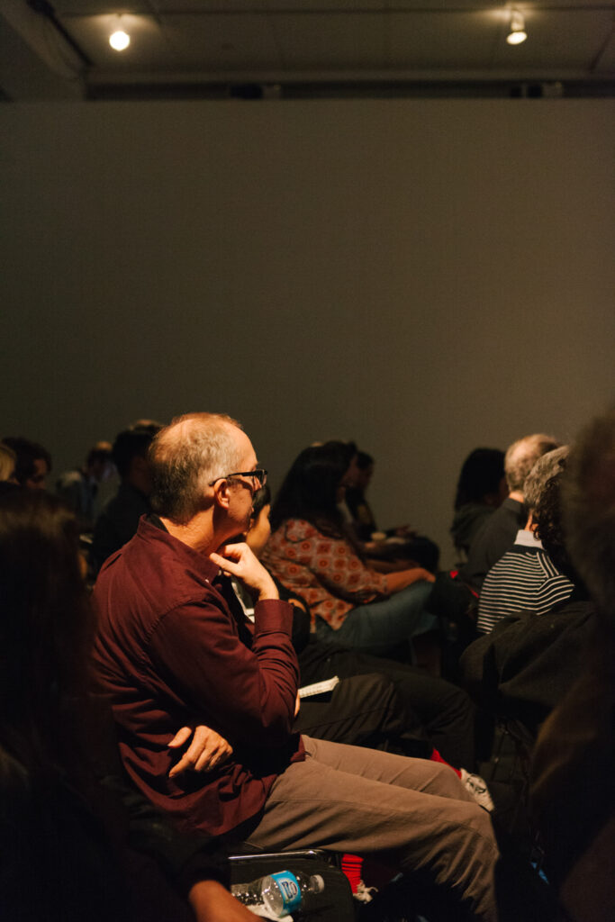 Audience member looking at Daniel Landau during Daniel's lecture.