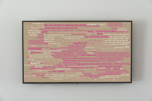 TV with pink and white text