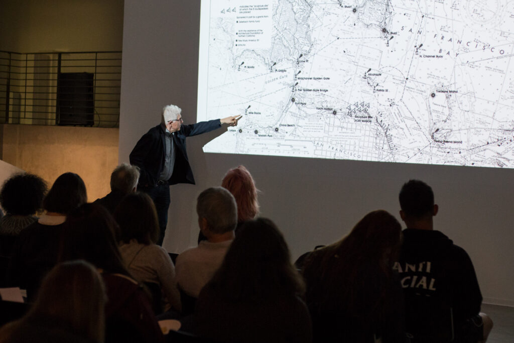 Bill Fontana pointing to a map of San Francisco.